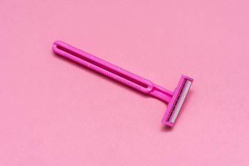 Pink female razor. Pink women's disposable razor . Hygiene skin body care concept. Hair removal