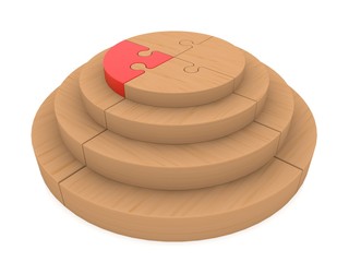 Wooden puzzle construction with red puzzle piece on top