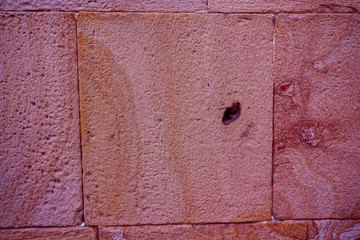 Stone and brick wall texture. Lush Lava colored bricks. Antique architectura.