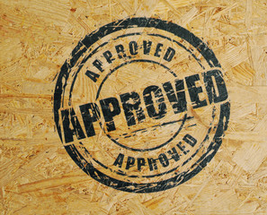 Stamps for the pub on the plywood wall.
