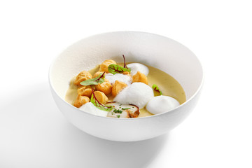 Wild mushroom cream soup with cheese profiteroles