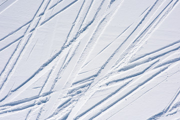 Ski tracks in the fresh snow. Natural background with lines - 330758254