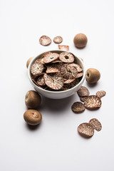 Betel nut chips in a bowl also known as slices of supari in india, used in Paan masala