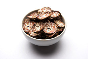Betel nut chips in a bowl also known as slices of supari in india, used in Paan masala