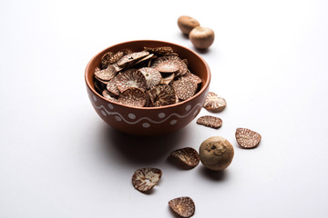 Betel nut chips in a bowl also known as slices of supari in india, used in Paan masala