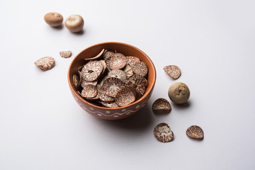 Betel nut chips in a bowl also known as slices of supari in india, used in Paan masala