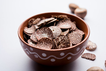 Betel nut chips in a bowl also known as slices of supari in india, used in Paan masala