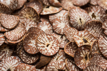Betel nut chips in a bowl also known as slices of supari in india, used in Paan masala