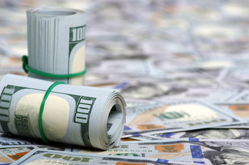 Hundred dollar bills rolled