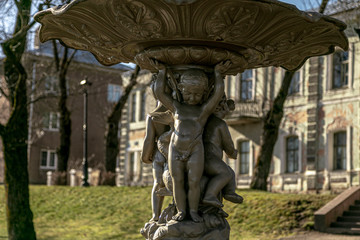 Fototapeta premium A fragment of the fountain. Figures of children