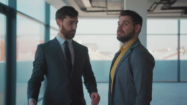 Slow motion real estate agent gives the keys man shake hands smile client beautiful rent investment agent bright business mortgage sale apartment interior close up