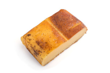 Piece of smoked cheese isolated on white background. Side view.
