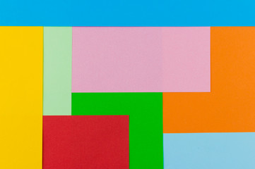 texture of bright abstract shapes of different colors lined with paper