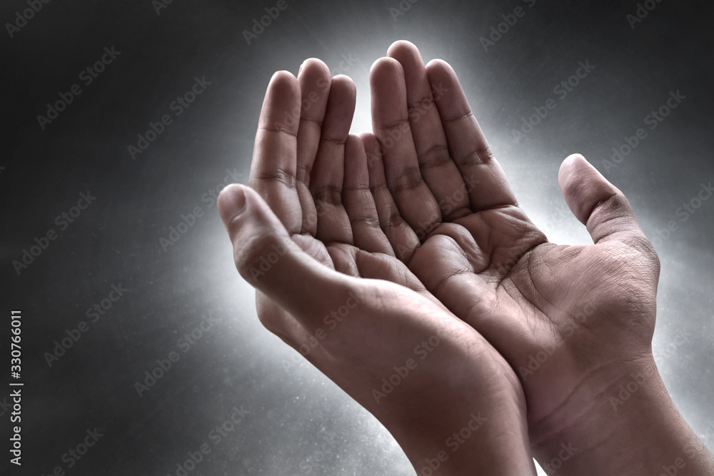 Wall mural Hands of muslim man praying