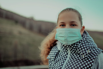 Coronavirus and Air pollution pm2.5 concept.Little girl wearing mask for protect pm2.5.Kid girl...