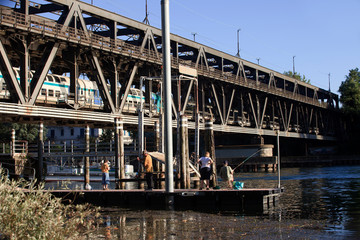 Sesto Calende (VA), Italy - September 15, 2016: A fisherman near the bridge between Lombardy and Piedmont, Lombardy, Piedmont, Italy.