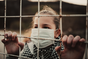 Coronavirus and Air pollution pm2.5 concept.Little girl wearing mask for protect pm2.5.Kid girl imprison at home for protection corona virus.Wuhan coronavirus and epidemic virus symptoms.