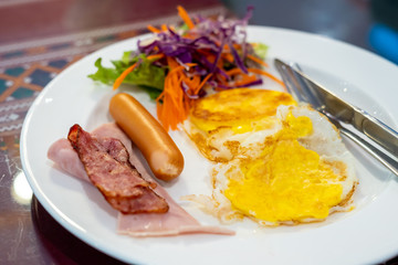 Fried egg, ham, sausage, American breakfast  top view table 