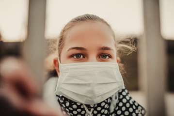 Coronavirus and Air pollution pm2.5 concept.Little girl wearing mask for protect pm2.5.Kid girl imprison at home for protection corona virus.Wuhan coronavirus and epidemic virus symptoms.