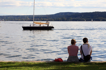 Fototapeta premium Angera (VA), Italy - September 15, 2016: Tourist relaxing at Angera Lake, Angera, Maggiore Lake, Varese, Lombardy, Italy.