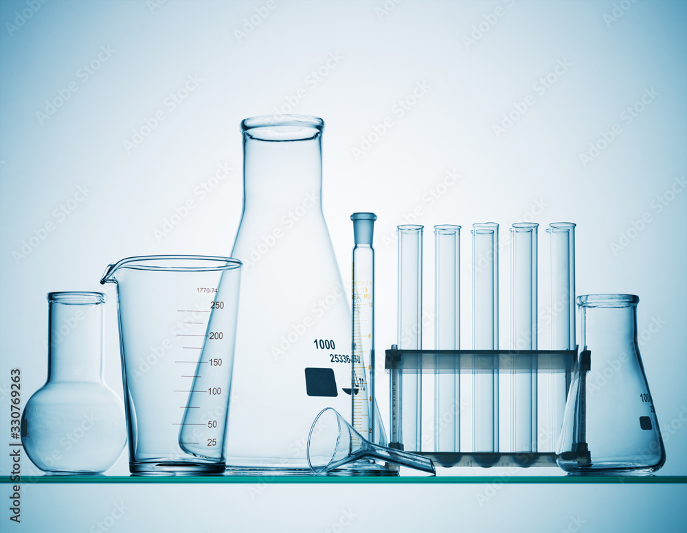 Sticker different laboratory glassware with liquid and with reflection