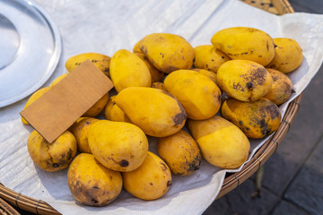 Yellow ripe mango Namdokmai species Thailand sells in the market.