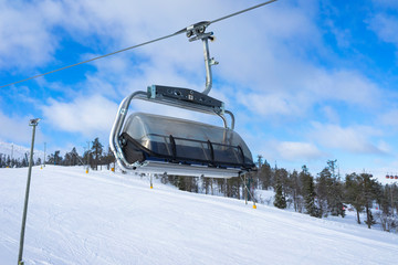 Obraz premium Ski slope with ski lifts on the ski resort