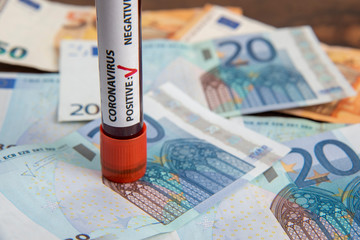 euro banknotes and coronavirus blood test economic crisis 