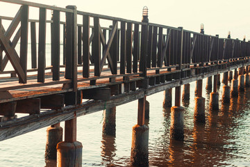 A wooden pier, at sunset. Thailand.