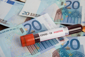euro banknotes and coronavirus blood test economic crisis 