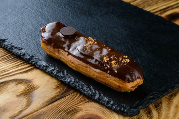 Eclairs on a wooden table