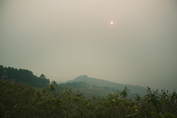 The sunset in the evening and full of haze from burning forests