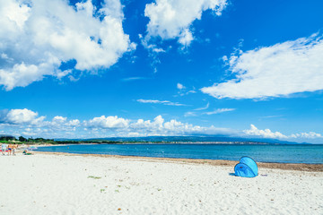 Fototapeta na wymiar Tent on the beach on a cloudy summer day