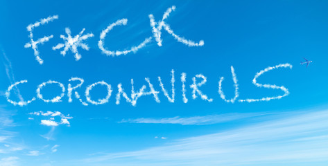 Naklejka na ściany i meble F*ck Coronavirus written in the sky with airplane contrails