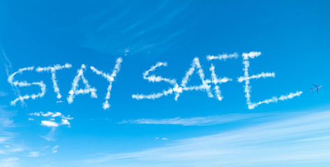 Stay Safe written in the sky with airplane contrails