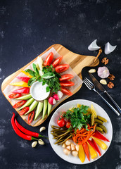 set of appetizers of fresh and pickled vegetables