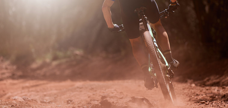 Mountain bikers riding on bike singletrack trail, mountain bike race	