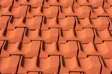 Fototapeta premium Red roof tiles in an endless pattern