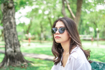  Beautiful Asian women with long hair wearing a white shirt. White bug hat, jeans showing emotions In the nature park-09.jpg, Asian beautiful woman with yellow skin, long black hair, wearing a white s