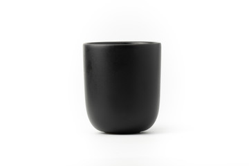 Black ceramic cup, beautifully designed, modern, white background