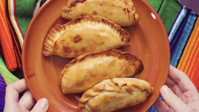 Flat lay. Homemade large empanadas with different staffings.