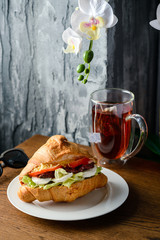 croissant stuffed with tea on the table