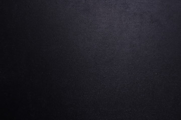 Fototapeta premium Black textured background with a gradient.