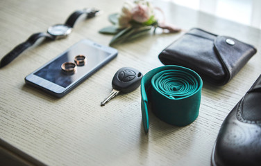 different accessories of a businessman for creating a style of a people lie on a wooden background
