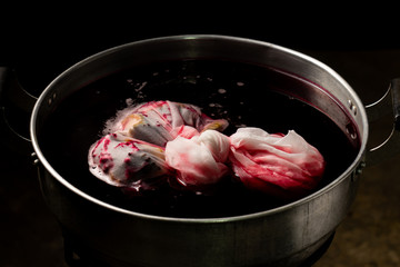 Thai herbs dried, such as roselle, quince, jujube, Chinese medicinal properties. Hypertension, heart disease on a black ceramic plate, white background