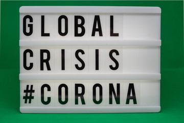 a light box with the inscription: GLOBAL CRISIS #CORONA