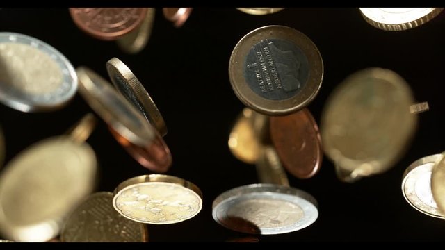 Euro coins falling from the sky along with Bitcoin. 4k, in 1000 fps, super slow motion.