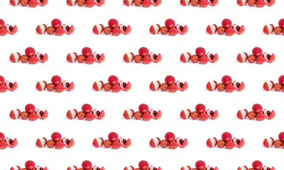 Colorful lychee fruit pattern on a white background, side view