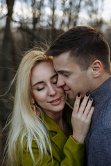 Fototapeta premium boy and girl cuddling in the park