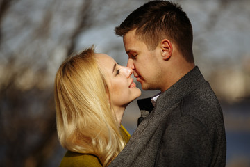 kisses of a couple in love in the park